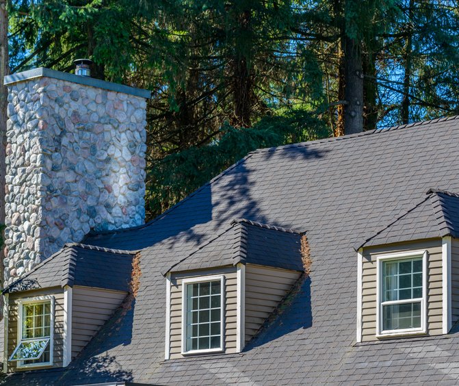 Custom home with a complex roofline in Greenwood Village, Colorado