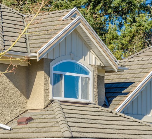 Completed asphalt shingle roof replacement on a suburban Colorado home